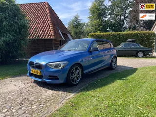 BMW 1-serie M135i-320PK-LEER-CAMERA-AKRAPOVIC-XENON-